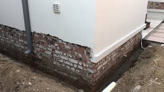 Damp proofing house walls below ground level [upl. by Mike]