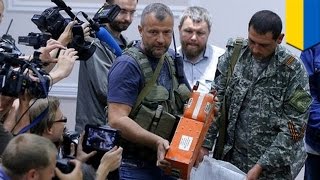 Ukraine rebels turn over bodies and flight recorders from MH17 crash [upl. by Rochester788]