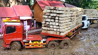 JALAN PARAH BERLUMPUR 🔥‼️ RC TRUK HINO TRAILER DAN QUESTER BERMUATAN KAYU OFROAD DI JALAN BERLUMPUR [upl. by Shanly776]