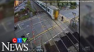 Caught on cam Reckless pedestrian nearly hit by train [upl. by Pradeep]