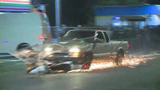 Pickup plows through protester crowd drags motorcycle [upl. by Ness639]