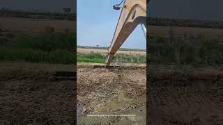 use an excavator equipped with a rake to level shrimp ponds [upl. by Neelyam195]