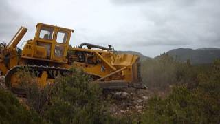 Caterpillar D9G dozer cleaning virgin place to build a solar energy power station  Greece [upl. by Yrebmik]