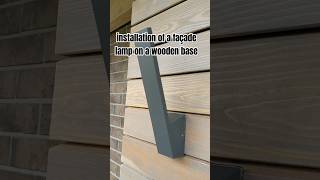 installation of a façade lamp on a wooden base [upl. by Aikel]