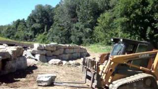 How to build a Limestone Retaining Wall Hurleys New Lawns [upl. by Doownel]