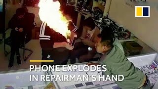 Phone explodes in repairmans hands in China [upl. by Llain525]