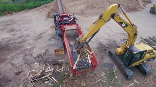 Morbark 6400XT Horizontal Grinder Processing Pallets Stumps and Yard Waste [upl. by Ahseiyk968]