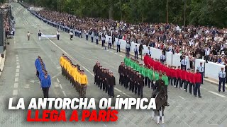 La antorcha olímpica llega a París en el día de la Fiesta Nacional en Francia I MARCA [upl. by Hutchison]