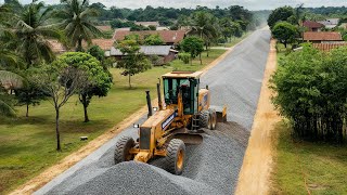 Wow Rural road construction a KOMATSU motor grader pushes gravel to make a foundation new street [upl. by Ymirej]