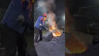 The process of manual feeding of furnace workers in foundry [upl. by Hsakaa]