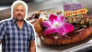 Guy Fieri Eats Chuleta KanKan Fried Pork Chop  Diners DriveIns and Dives  Food Network [upl. by Klepac512]