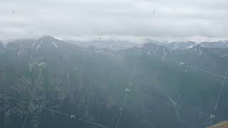 A winding road and a mountain river in the gorge of the mountains [upl. by Lallage]