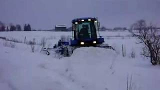 Snowmobile Trail Grooming New Holland TV 140 Four Track With the new VARIBLE WIDTH SNOW DRAG [upl. by Llewsor]