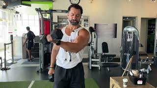 How To Perform A Dumbbell Cross Body Raise Exercise [upl. by Kilroy]