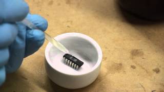 Decapping ICs removing epoxy packaging from chips to expose the dies [upl. by Lunnete]