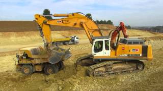 Liebherr R974B loading Caterpillar 769D770 [upl. by Goar880]