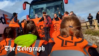 Driver ploughs through Just Stop Oil protesters blocking migrant coach heading to Bibby Stockholm [upl. by Venuti194]