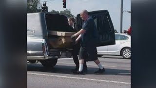 Body in cardboard coffin falls out of hearse [upl. by Tabor]