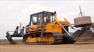 Laying field drainage  Komatsu D65P Vplow Bulldozer  Gebr Emonds drainage system [upl. by Ybbed]