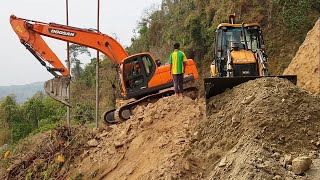 JCB Backhoes Excavators Hydraulic Hammers All Work to Widen Rocky Mountain Road [upl. by Anelhtac]