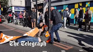 I have to go to hospital Motorists drag Just Stop Oil protesters off the road in London [upl. by Hudgens]