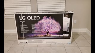 LG OLED C1 Unboxing Assemble Setup and First Impressions [upl. by Thorrlow756]