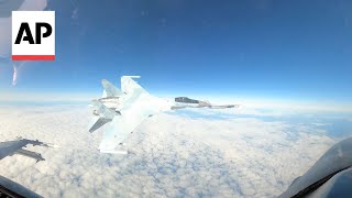 Video shows Russian jet flying within feet of US F16 near Alaska [upl. by Sternlight]