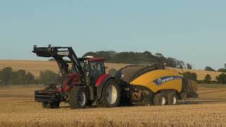 Valtra T234 Baling with New Holland BB1290 Square Baler [upl. by Ecinnaj]