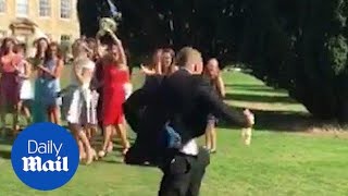 Boyfriend RUNS FOR THE HILLS as girlfriend catches wedding bouquet [upl. by Tillo]