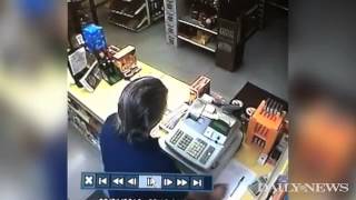 Robber pulls gun liquor store clerk is faster [upl. by Shani]