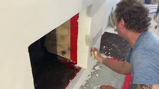 How to do a semi smooth stucco over a brick fireplace Part 2 [upl. by Adlemy892]