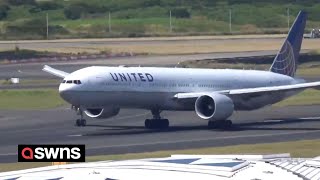 Boeing plane forced to land after fluid is seen spilling from landing gear  SWNS [upl. by Corby]