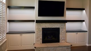 Custom built in cabinets floating shelves and fireplace mantel [upl. by Acirrej]