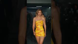 quotGigi Hadid Stuns in Iconic DHL Tape Dress at Fashion Show – Breaking the Runway Normsquotgigihadid [upl. by Matthia]