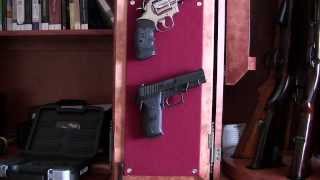 Hanging pistols inside gun cabinet [upl. by Charles]