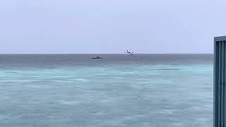 De Havilland Canada DHC Twin Otter of Manta Air lands at Amilla Resort Maldives in heavy rain [upl. by Eelidnarb569]