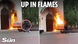 Moment antiPutin protester hurls Molotov cocktail at Russian military church setting it on fire [upl. by Ellivro]