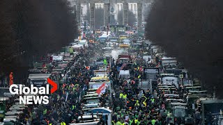 German farmers block streets with tractors in protest of proposed agricultural tax increase [upl. by Elletnuahc]