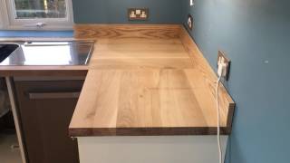 Solid oak worktop installation supplied by Worktops express [upl. by Notlehs]