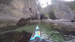 Playing in the waterfall north of Cape Flattery  Sea kayaking the H2O Project [upl. by Leshia]