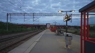 Sweden Stockholm Rotebro Train Station Arlanda Express passing by [upl. by Ardnuaek309]