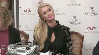 Paris Hilton tries to sell some weird app thing in Paris while on a tour to save the world with love [upl. by Denoting420]