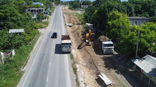 WORK RESUME ON DRAINAGE SYSTEM IN PROSPECT SOUTHERN COASTAL HIGHWAY IMPROVEMENT PROJECT [upl. by Ativoj616]