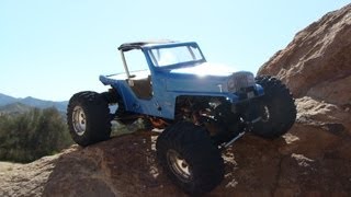 Blue jeep CJ axial AX10 scale rock crawler body mod soft top and new roll cage [upl. by Conley]