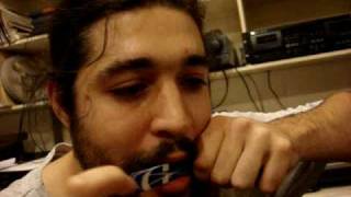 Slim DEFALLA plays the phone card Jews harp [upl. by Leumhs]