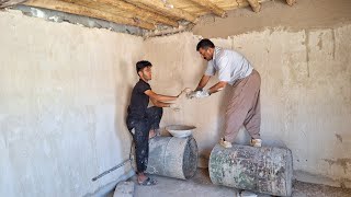 Plastering by Hossein and Mohammad in repairing the remaining walls of the house [upl. by Fellows]